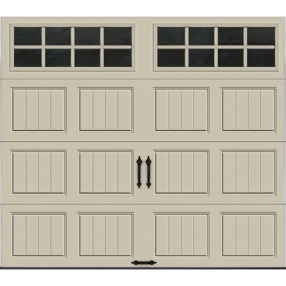 Tan carriage house style garage door with windows and decorative hardware