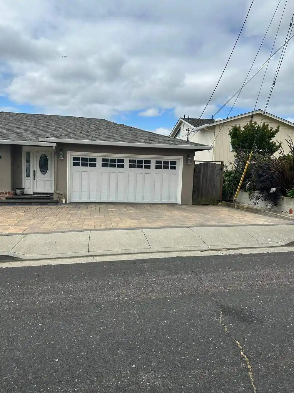 White carriage house style garage door with windows