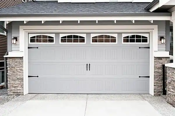 Carriage house garage door style with decorative hardware