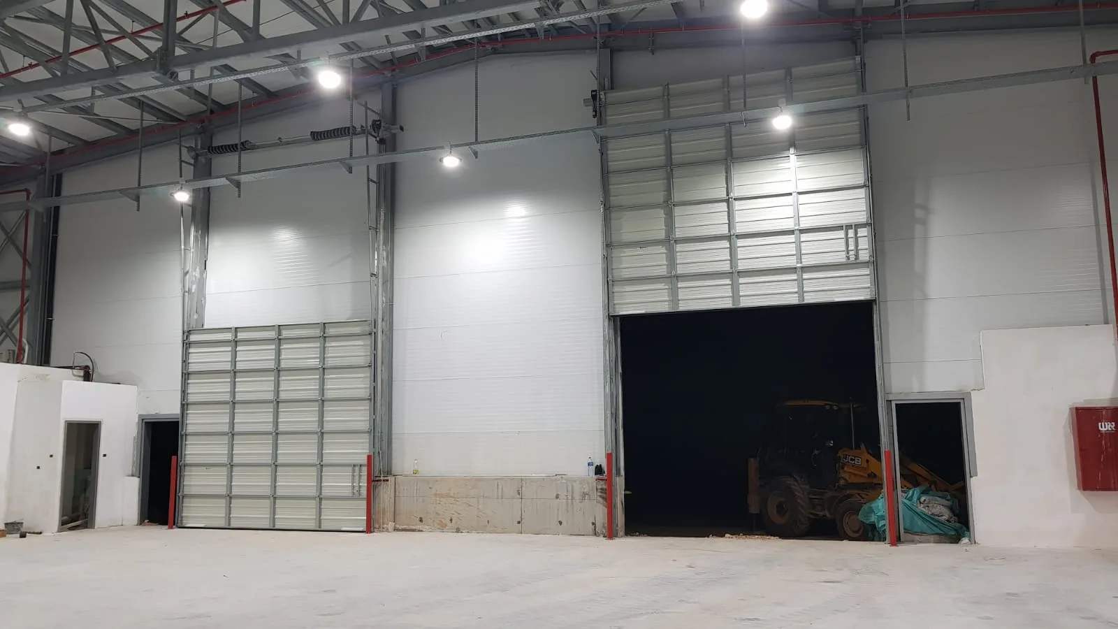 Large commercial warehouse with two big overhead doors