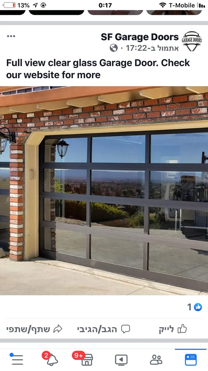 Full-view clear glass garage door on modern home