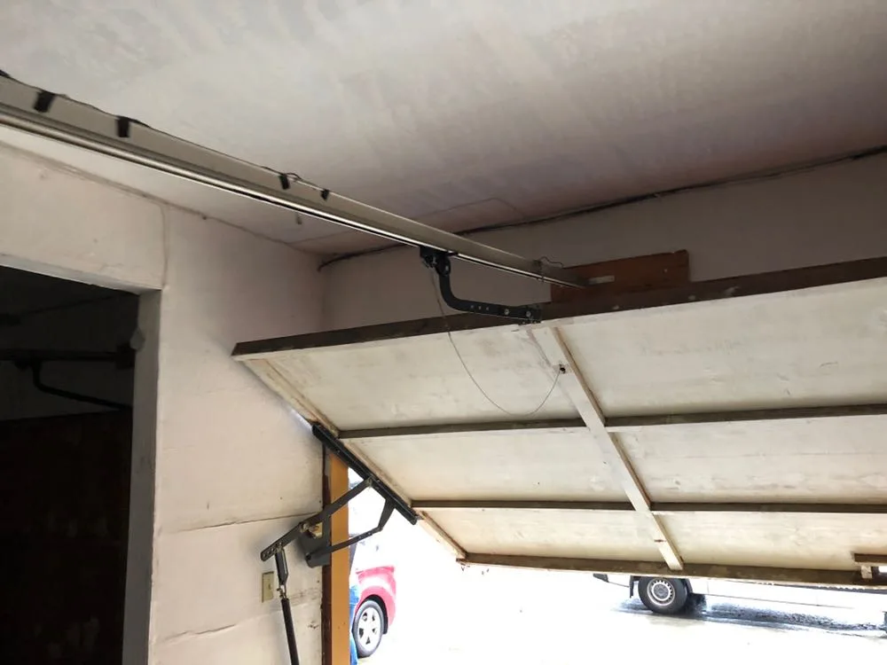 Garage door track and cable hardware during repair
