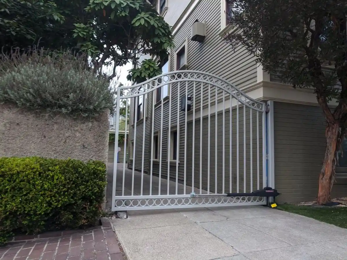 Ornamental driveway gate with automatic opener installed by Integrity