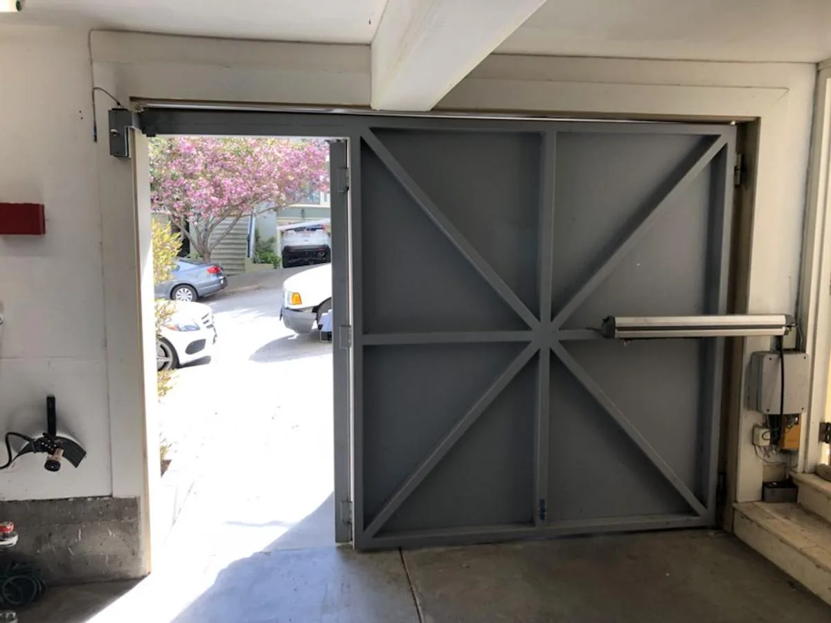 Heavy steel swing gate with arm operator