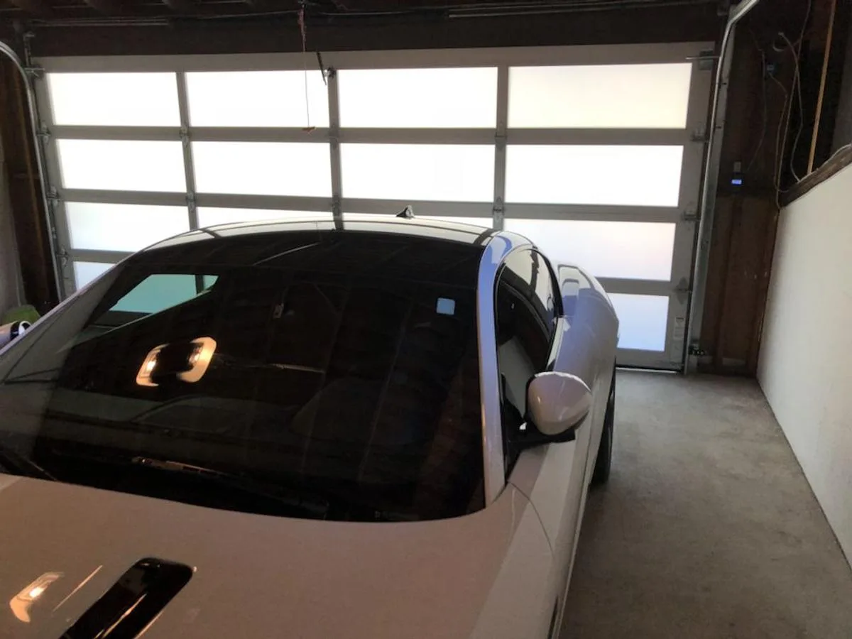 Glass garage door viewed from inside showing natural light