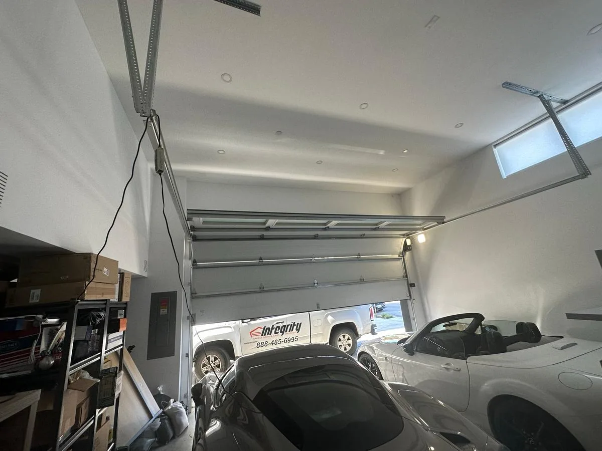 Luxury garage interior with Integrity truck visible through door