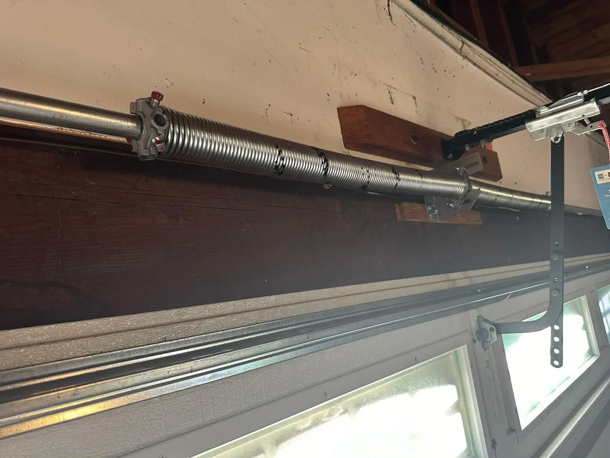 New torsion spring installed on garage door by Integrity Garage Doors