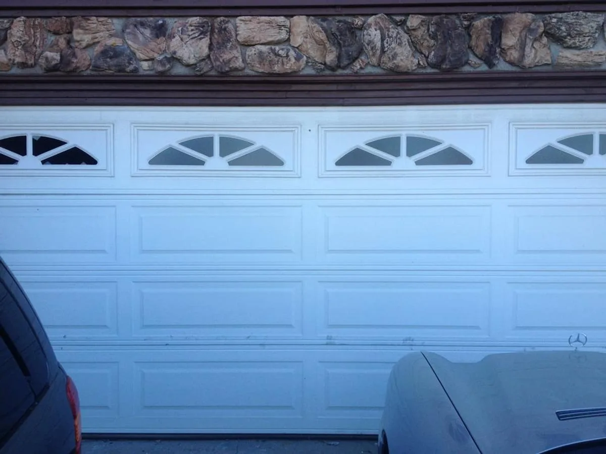 Traditional raised panel garage door after off-track repair